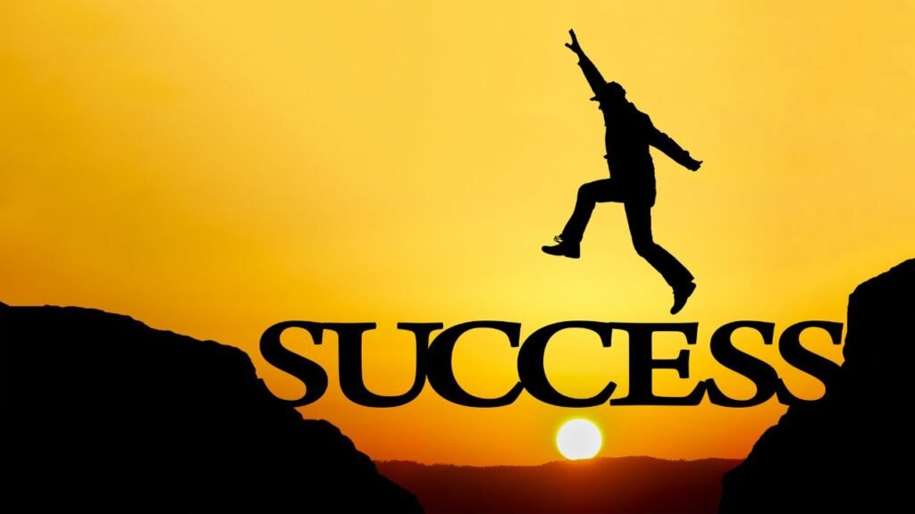 A silhouette of a person jumping across a gap between cliffs with the word "SUCCESS" bridging the gap against a yellow-orange sunset background. The composition symbolizes overcoming challenges to achieve success, with the sun positioned near the horizon emphasizing a moment of accomplishment.