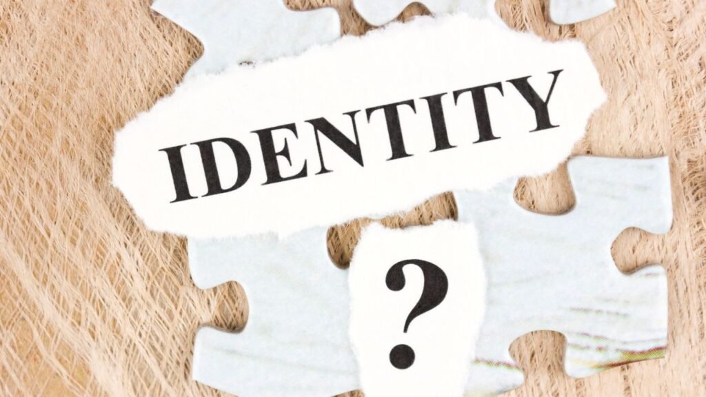 Puzzle pieces with the word identity, illustrating the process of self-discovery during the Stages of Identity Shift