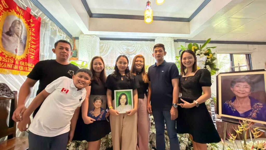 Ninety-Three Years of Love: What Lola Inay Taught Me About a Life Well Lived 8 Family members gathered at a funeral service, holding memorial portraits while honoring their beloved grandmother